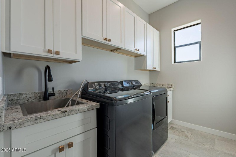 Laundry room w/utility sink and storage