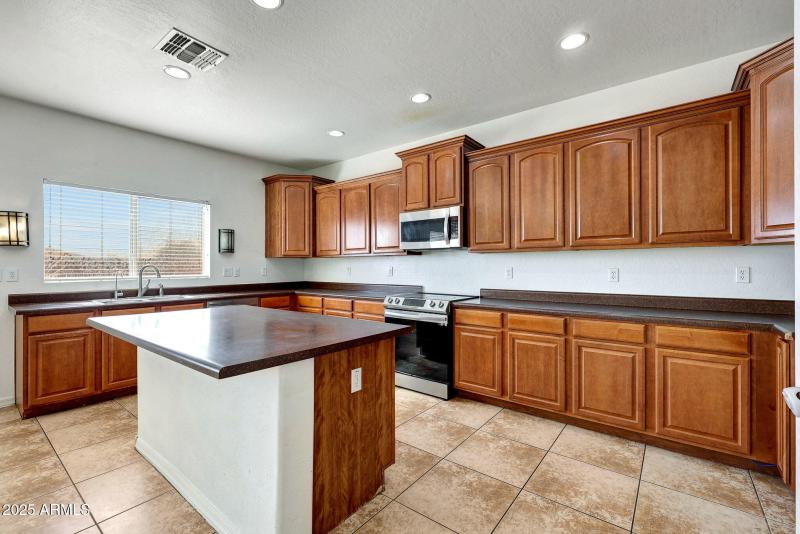 Kitchen with island and breakfast bar