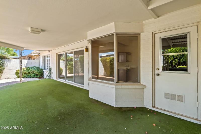 COVERED PATIO (DOOR TO UTILITY ROOM)