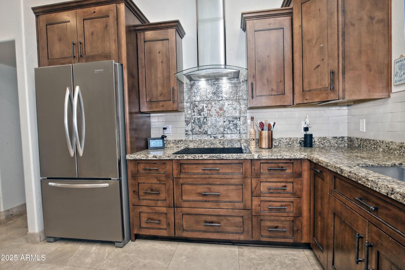 Granite kitchen with knotty alder cabine