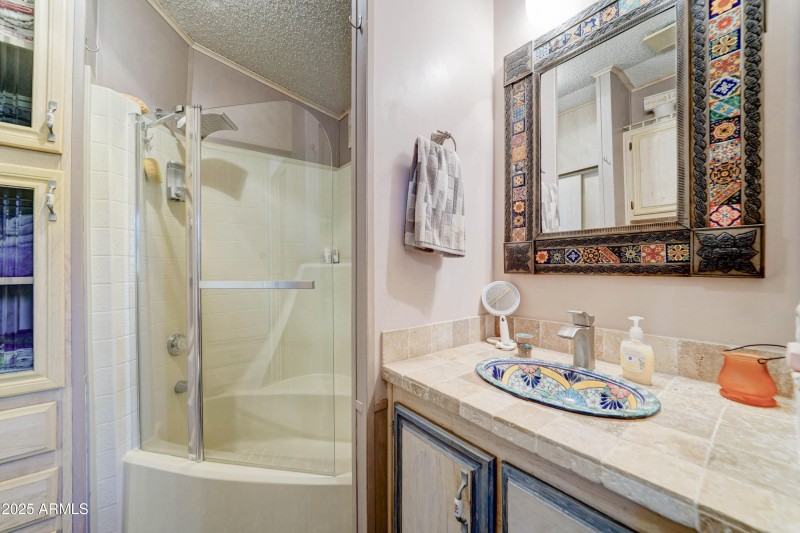 bathtub with glass enclosure