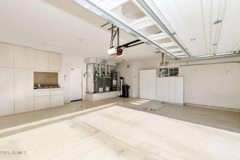 Garage with cabinets and work bench