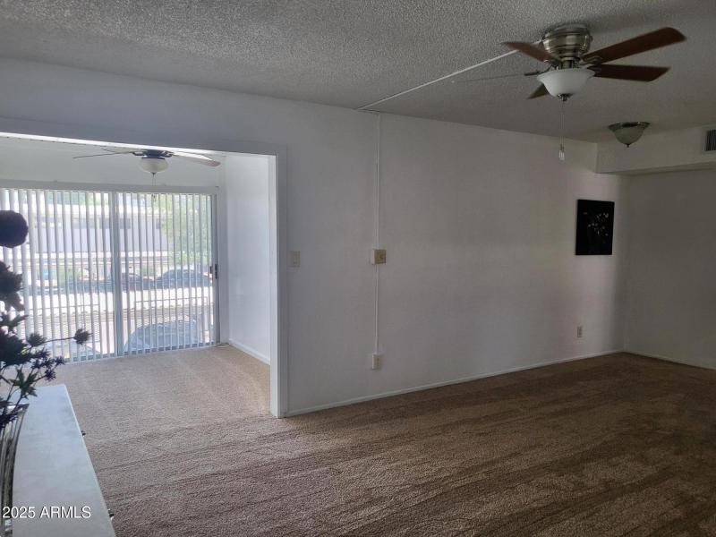 LIVING AREA & ENCLOSED BALCONY