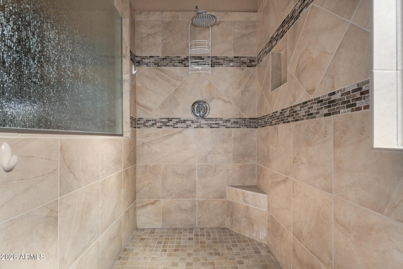 With custom tile walk-in shower