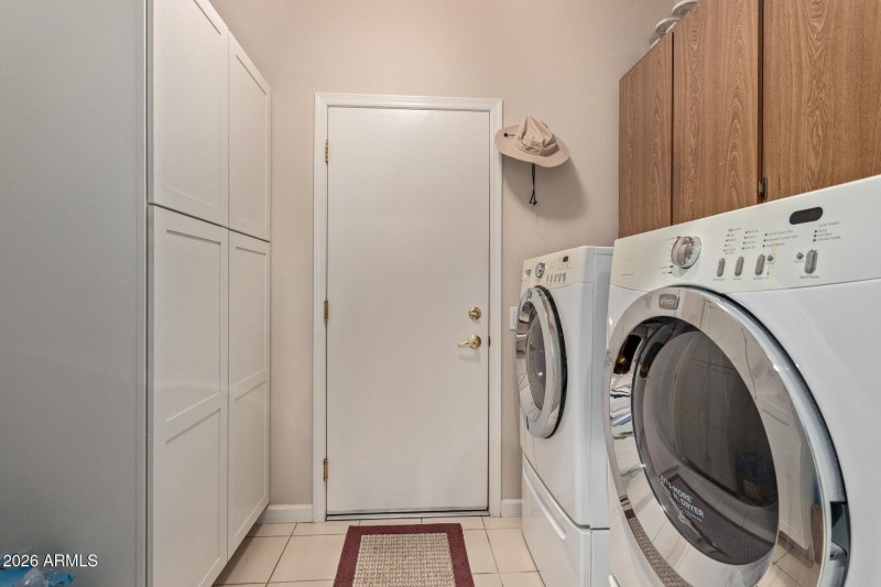 laundry room with extra storage