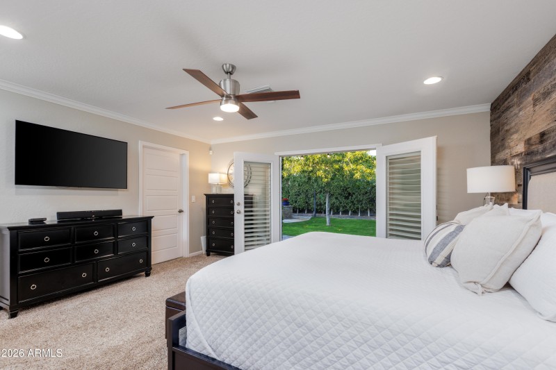 Primary bedroom w/ French doors to back