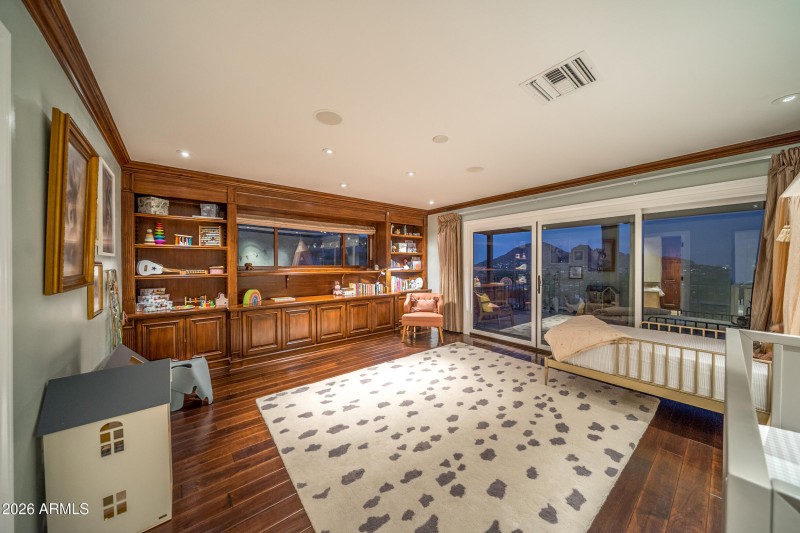 Main Floor Guest Room with Rich Hardwood