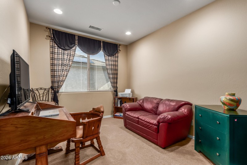 Den to the right of the entry