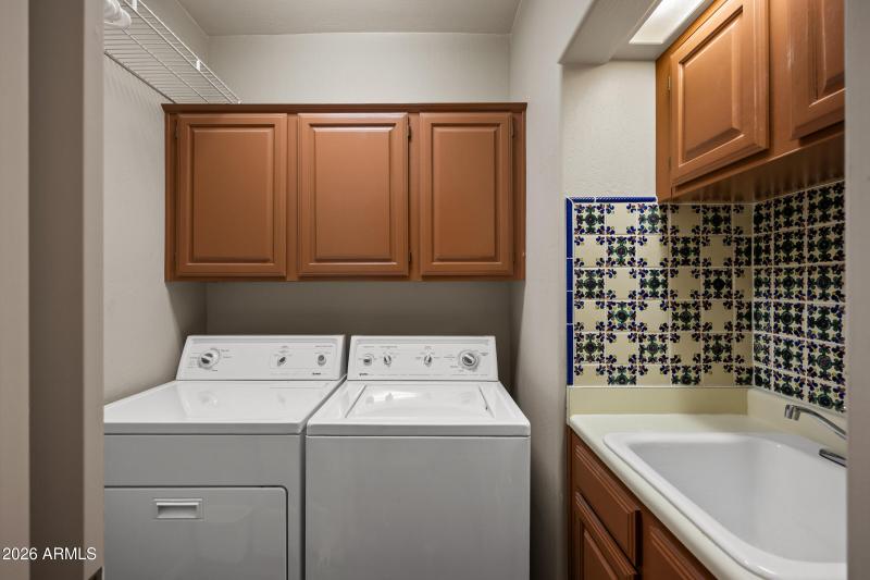 Laundry room w/cabinets & sink