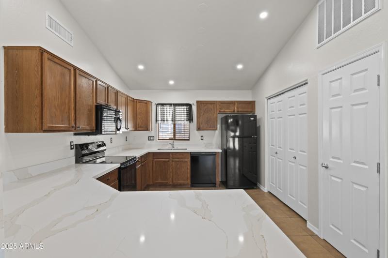 Kitchen with Brand New Quartz Counter To