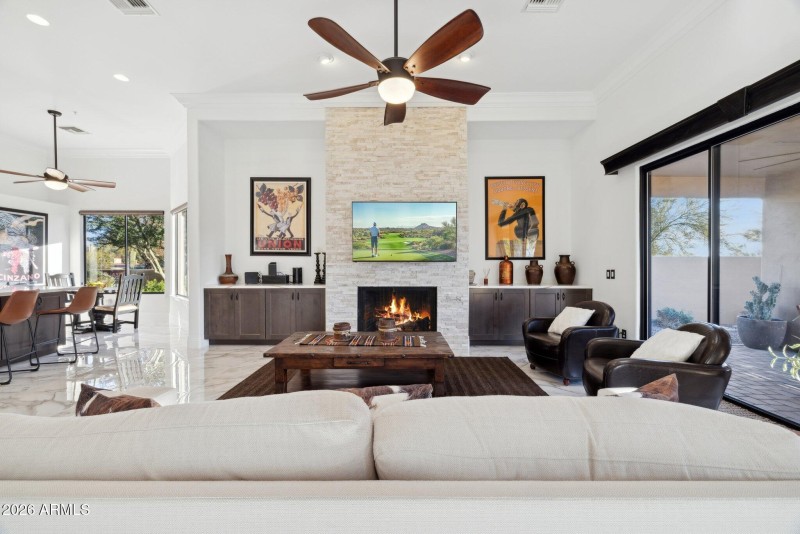 Family room with stacked stone fireplace