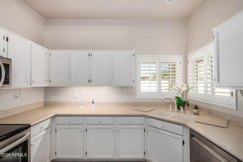 Kitchen Sik w/ a View of Backyard