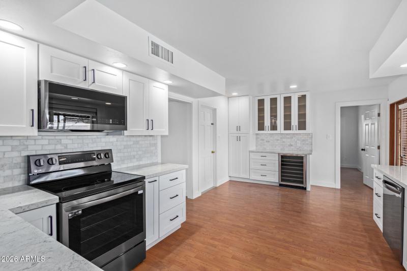 Kitchen with beverage refrigerator