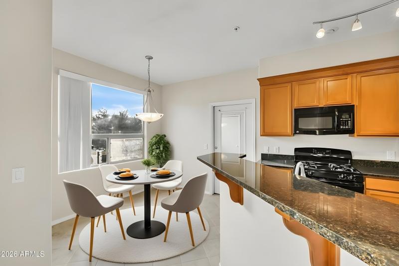 Sunny breakfast area with door to patio