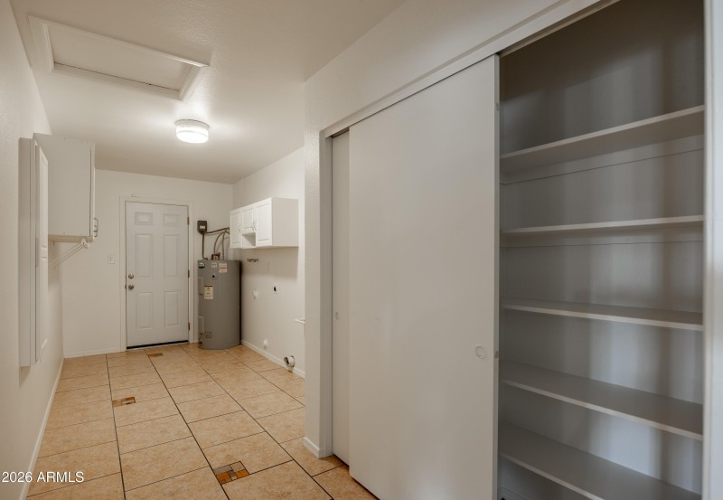 Huge laundry room with pantry