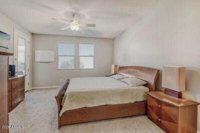 Spacious primary suite with patio access