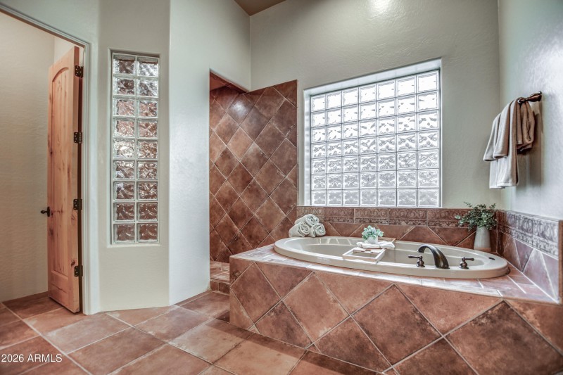 Primary tub shower and private toilet