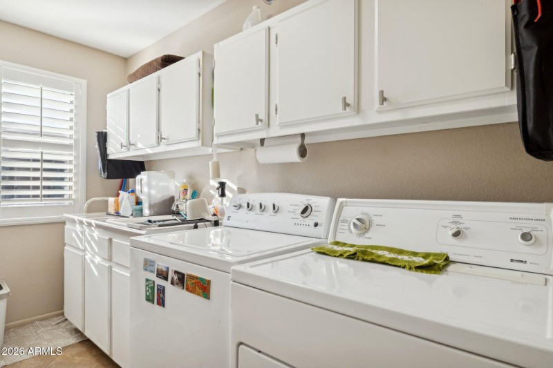 Laundry Room with sink and cabinets