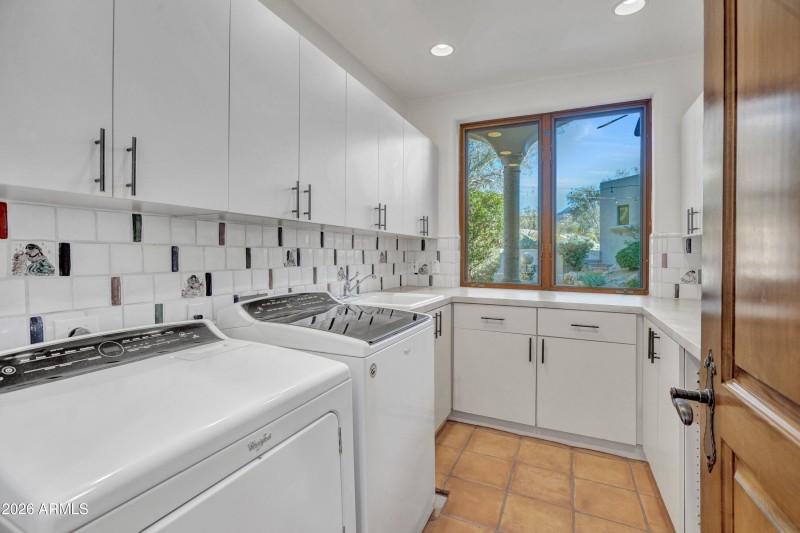 Laundry with storage cabinets