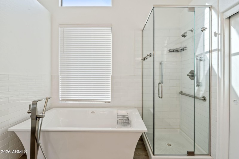 Bath tub and shower at Primary Bathroom