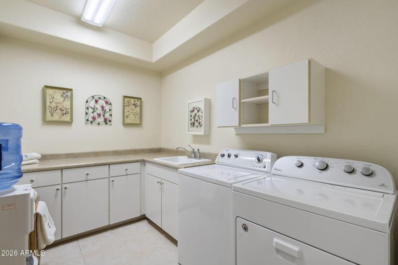Spacious laundry room with sink