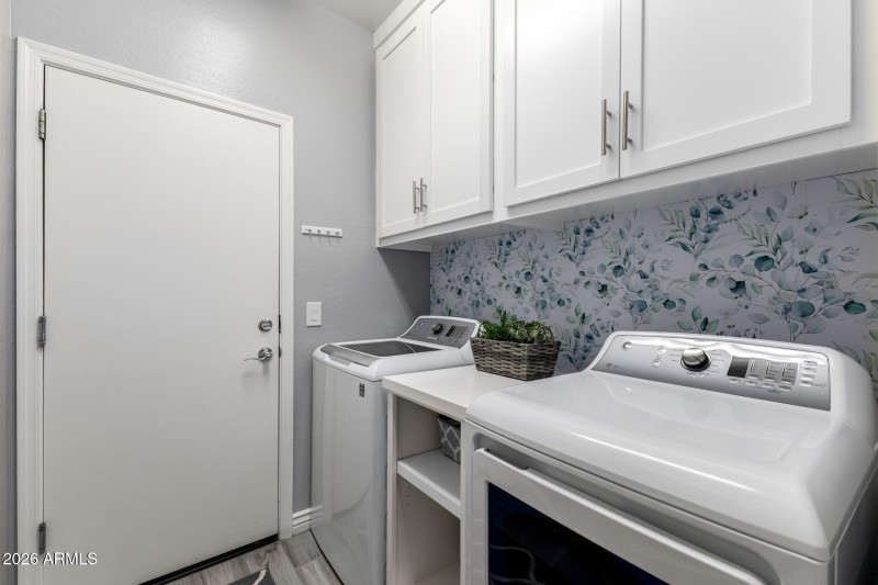 Added upper laundry room cabinets