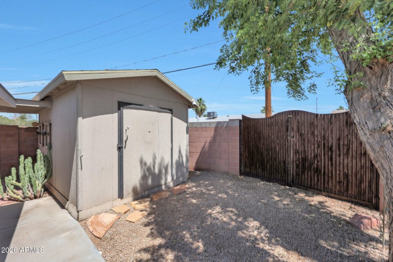 Storage Shed w/ large iron gate