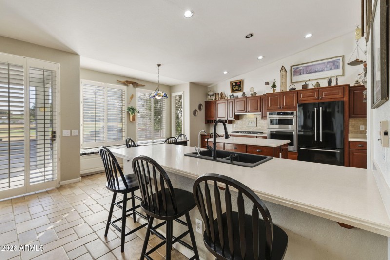 Kitchen breakfast bar and patio access