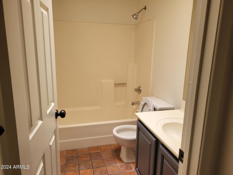 hall bath with entrance to Bedroom 1