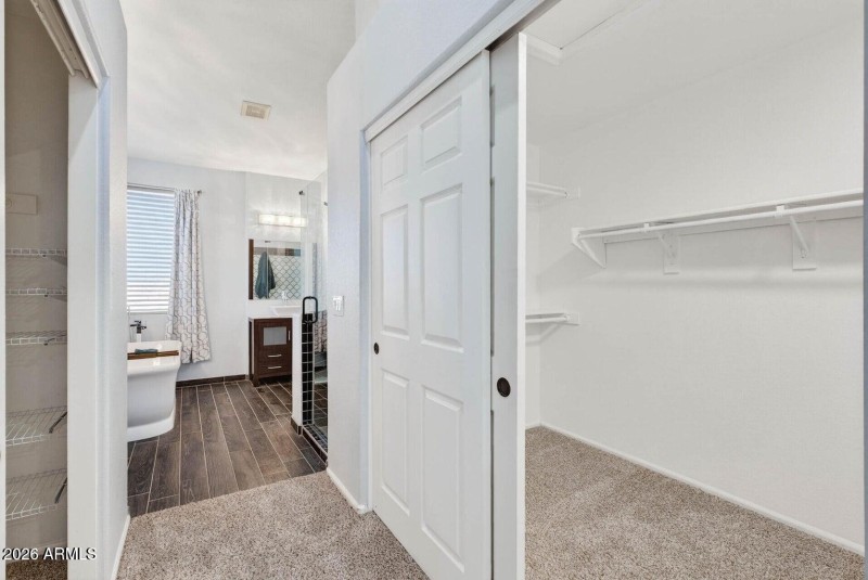 20 - Primary bedroom entry to bathroom