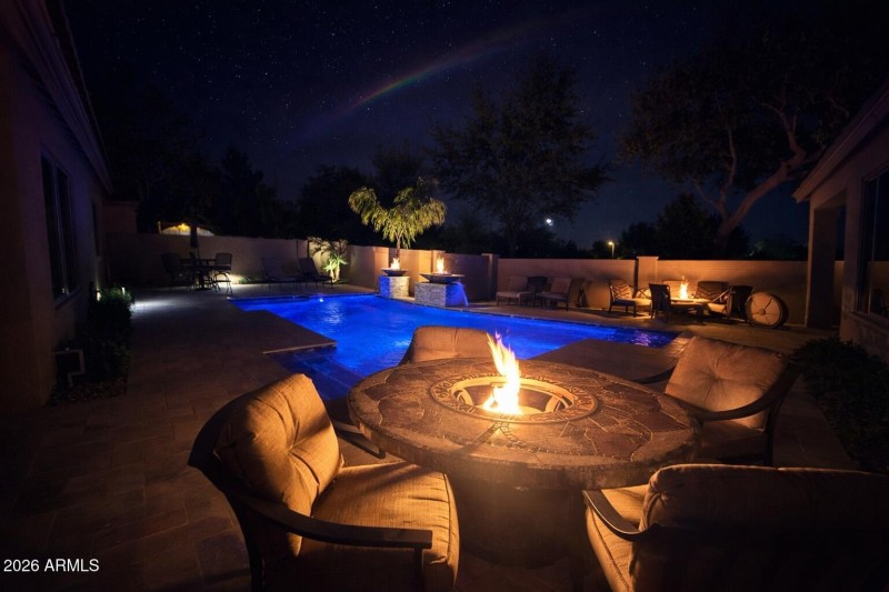 Firepit by backyard oasis