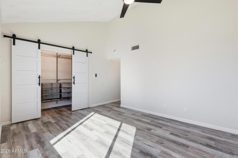 Primary Bdrm w/ built in closet shelves