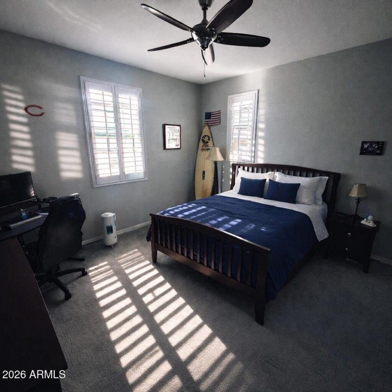 Sunlit bedroom with plantation shutters