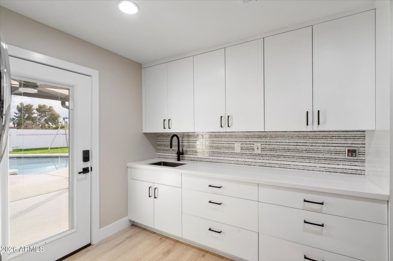 Laundry Room w Built In Cabinets