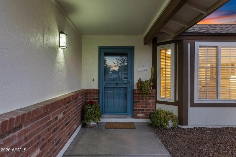 Charming Covered Entry w Brick Accents