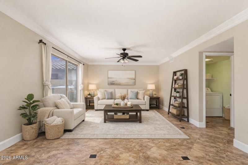 Bright and airy living room with laundry