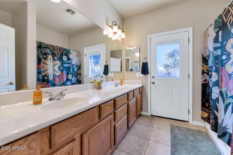 Hall bath w/ exit to backyard