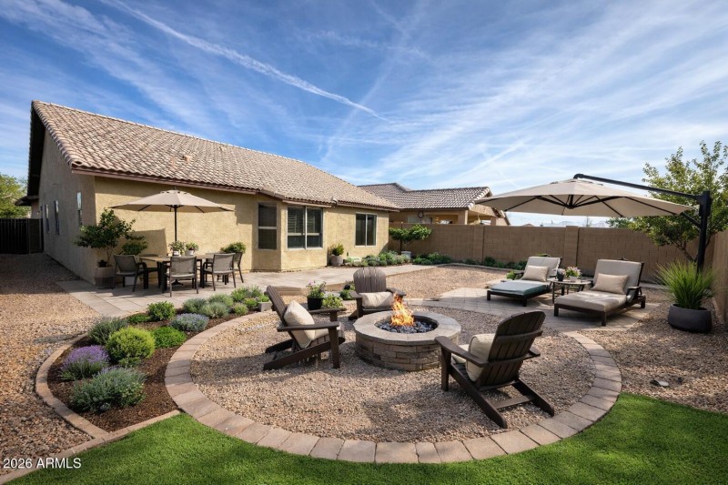 Backyard retreat with fire pit and seati