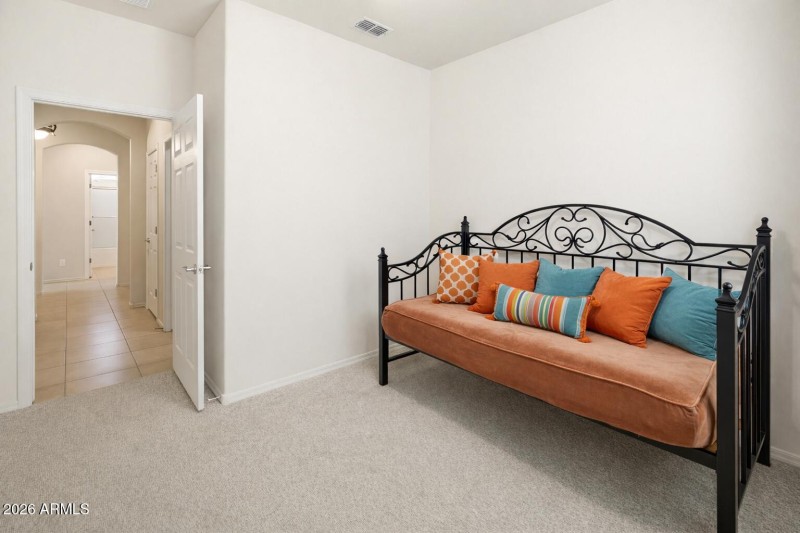 Cozy bedroom with wrought iron daybed