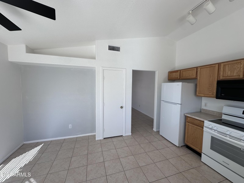 KITCHEN AND DOORWAY TO GREAT ROOM