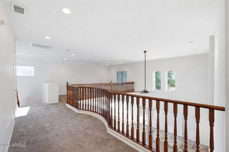 Elegant curved railing in bright hallway