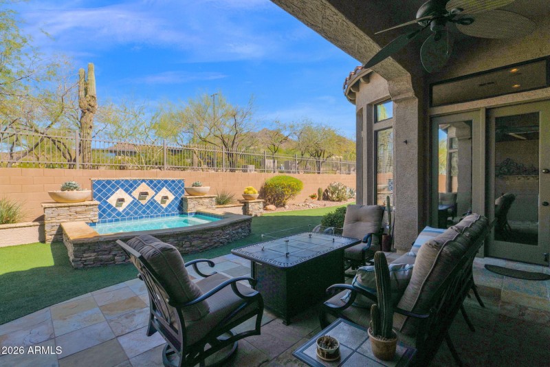 Patio overlooks heated spa/water feature