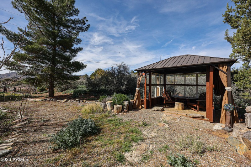 backyard with glass walled gazebo