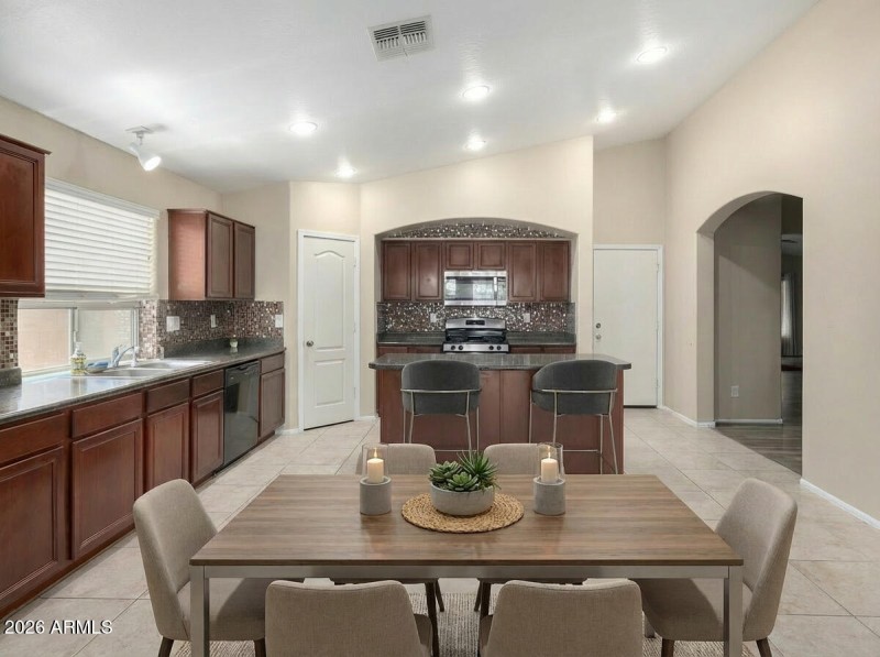 Spacious Kitchen With Cherry Cabinets