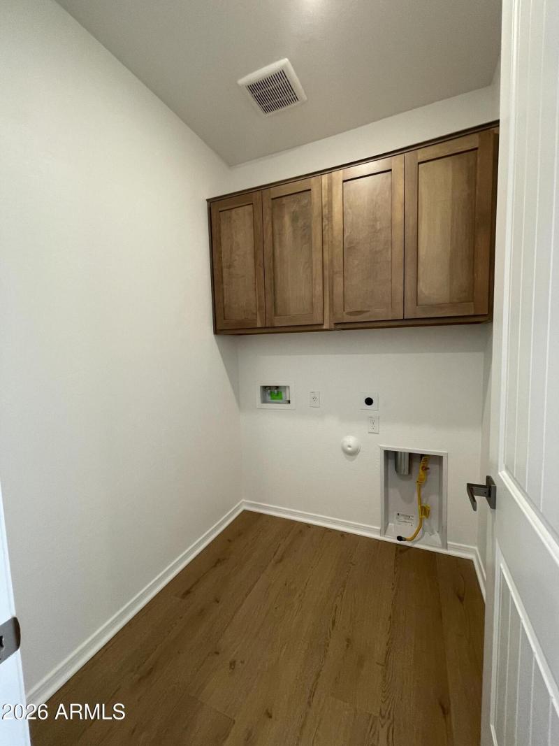 Laundry with cabinets