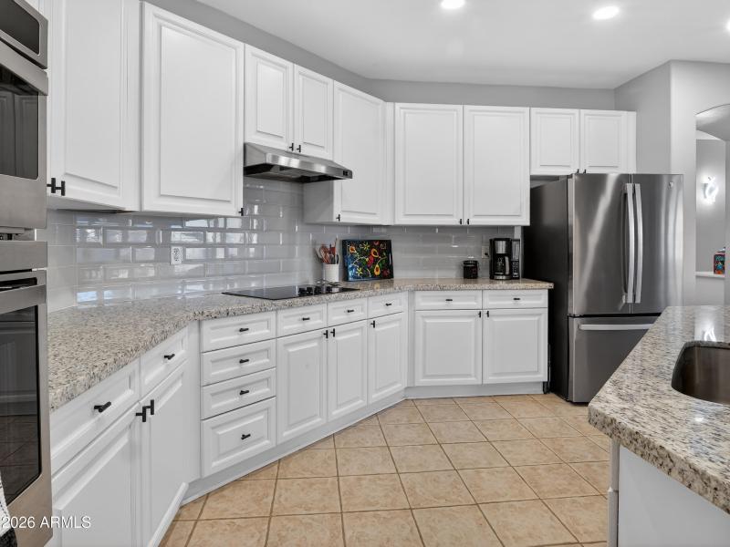 Spacious Kitchen with White Cabinets