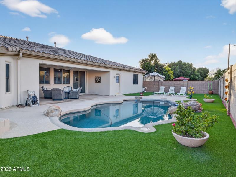Backyard Pool with Patio Seating