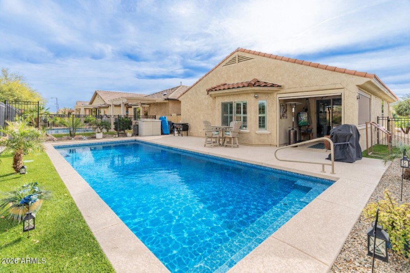 Sunny backyard oasis with pool