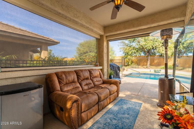 Sunny patio with pool view