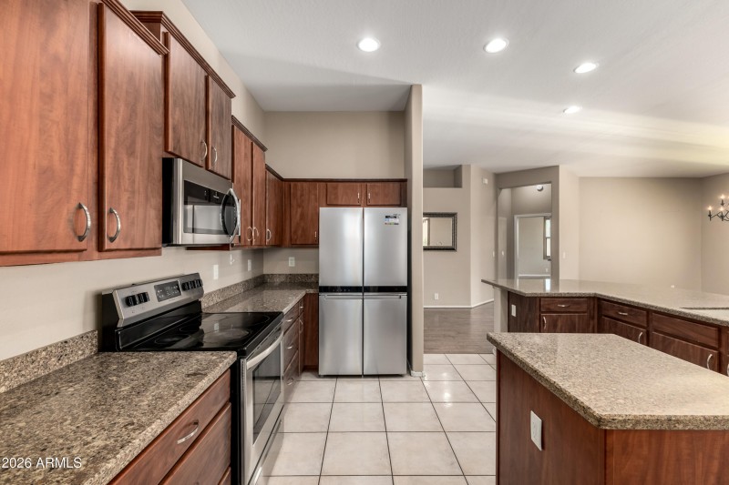 KITCHEN - GRANITE COUNTERS AND STAINLESS
